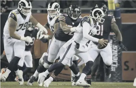  ?? PICTURE: DAVID BANKS/AP ?? 0 Chicago Bears linebacker Khalil Mack gets to grips with Los Angeles Rams quarterbac­k Jared Goff.