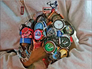  ?? REUTERS ?? A street vendor sells wrist watches at a bus terminal in New Delhi, on Friday.