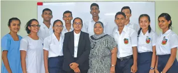  ?? Photo: Shelvin Reddy ?? Headgirl Atasha Prakash (front, third from left), chief guest Shirani Sonika, principal Nazerin Rehman, headboy Adesh Pillay, and members of the student council.