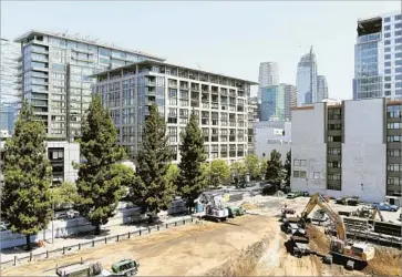  ?? Christina House ?? MEASURE JJJ’S proponents say it would provide good jobs and boost affordable housing. But opponents say its new rules would make it too expensive to build many projects. Above, a project last month in downtown L.A.