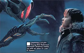  ??  ?? GRIPPING STUFF: Young Will Robinson (Maxwell Jenkins) meets up with an alien in Lost In Space