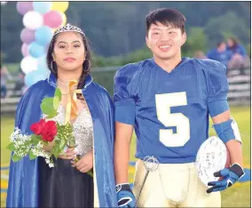  ?? Photo by Mike Eckels ?? Mathline Jesse (left) and Alex Lee were named the 2017 Decatur Homecoming queen and king during the coronation at Bulldog Stadium in Decatur Oct. 13. The ceremony was held prior to the Decatur-Westside football contest.