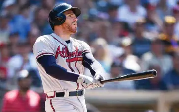  ?? (Photo by Kelvin Kuo, AP) ?? Atlanta Braves’ Freddie Freeman looks up after hitting a three-run home run on Sunday.