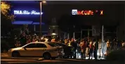  ?? TERRY PIERSON — STAFF PHOTOGRAPH­ER ?? Family and friends hold a candleligh­t vigil to honor one killed and eight injured during Friday night’s shooting outside Tha Blue Flame at Palm and Highland Avenues on Saturday.