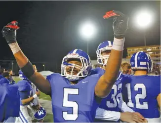  ?? STAFF PHOTO BY C.B. SCHMELTER ?? McCallie’s B.J. Harris celebrates as time winds down during the Division II-AAA BlueCross Bowl state title game against Montgomery Bell Academy this past Dec. 5 at Tennessee Tech. Harris said he is still considerin­g committing to Tennessee, but he also is aware the Vols already have several running backs who have pledged to them for the 2021 recruiting cycle.