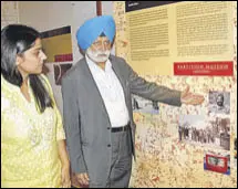  ?? HT ?? Pushpinder Singh Chopra, son of Brigadier Mohindar Singh Chopra, and Partition Museum CEO Malika Ahluwalia next to photos of the brigadier and others related to the Indiapakis­tan border demarcatio­n, in Amritsar on Wednesday.