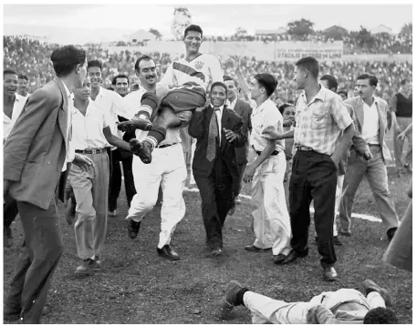  ?? AP ?? What a start: U.S. centre forward Joe Gaetjens is chaired by cheering supporters, after his team beat England 1-0, in the World Cup match at Belo Horizonte, Brazil in 1950.