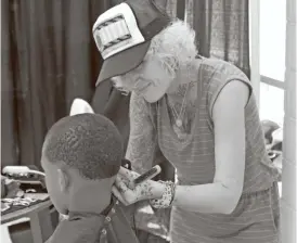  ?? Tyler Williams/ SJ ?? Students were getting ready for school with free haircuts at 101 Church’s Give a Kid a Chance outreach ahead of the start of the school year on July 29.