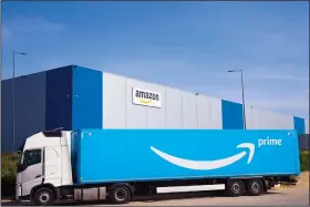  ?? (AP) ?? A delivery truck arrives at the entrance of an Amazon facility in Douai, northern France, earlier this year.