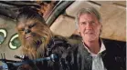  ??  ?? Chewie (Mayhew) and Han (Ford) are still best pals in “The Force Awakens.”