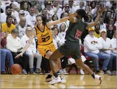  ?? DARRON CUMMINGS — THE ASSOCIATED PRESS ?? Iowa’s Caitlin Clark is defended by Indiana’s Chloe Moore-McNeil on Thursday in Bloomingto­n, Ind.