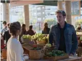  ?? MARK LEVINEVIA/W NETWORK ?? Scarlett (Clare Bowen) spies her ex, Gunnar (Sam Palladio), at the farmer’s market in CMT’s Nashville, airing on W in Canada.