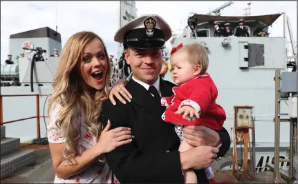  ??  ?? Petty Officer Titman with Laura and their eight-month-old daughter Ava after the surprise proposal