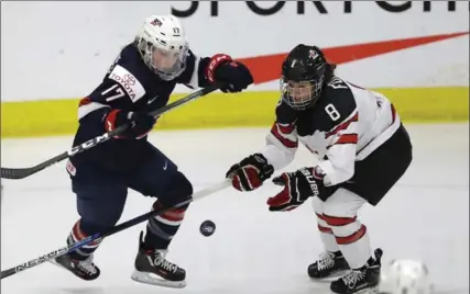  ?? CARLOS OSORIO, THE ASSOCIATED PRESS ?? Laura Fortino, right, is a veteran defenceman with the Canadian women’s Olympic gold medal-winning team. Wednesday is her day at Bishop Tonnos.