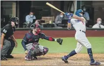  ?? Robert Gauthier Los Angeles Times ?? DODGERS center f ielder Cody Bellinger homers against the Atlanta Braves in the seventh inning of Game 7 in the NLCS.