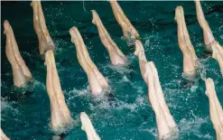  ??  ?? PYONGYANG: Swimmers perform in a synchroniz­ed swimming gala event in Pyongyang yesterday. The gala was part of a series of events being held to celebrate the birth of late North Korean leader Kim Jong-Il, who oversaw the country’s first nuclear tests....