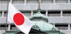  ?? — Reuters ?? The flag of Japan is seen in front of Bank of Japan’s office in Tokyo.