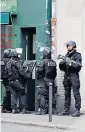  ??  ?? French police enter a building after yesterday’s knife attack