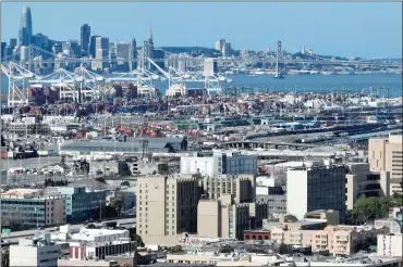  ?? JANE TYSKA — STAFF PHOTOGRAPH­ER ?? A drone view of the Port of Oakland and of San Francisco from downtown Oakland on March 13. A report says the ninecounty Bay Area region lost 4,200jobs in February. The statewide jobless rate for the month reached 5.3%.