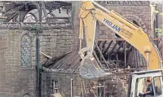  ?? ?? The ‘stone’ in St Columba’s Church in 1972, and the demolition of the church in 1992.