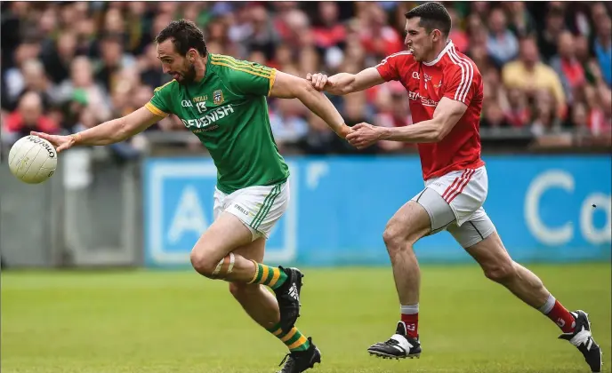  ?? Photo: Matt Browne/Sportsfile ?? Graham Reilly of Meath tries to shake off Louth’s John Bingham during the Leinster SFC quarter-final at Parnell Park.