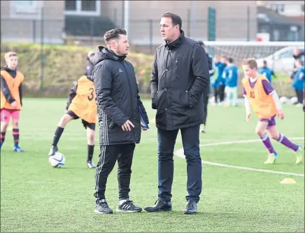  ?? Picture: SNS ?? NEW KIDS ON THE BLOCK: SFA performanc­e director Malky Mackay with developmen­t officer James Grady.