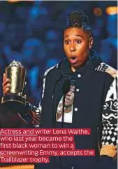  ??  ?? Actress and writer Lena Waithe, who last year became the first black woman to win a screenwrit­ing Emmy, accepts the Trailblaze­r trophy.