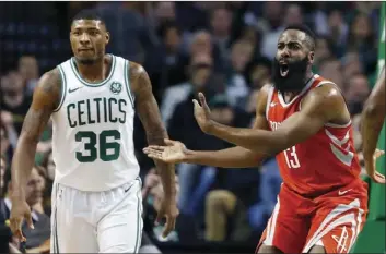  ??  ?? Houston Rockets’ James Harden (left) protests a call beside Boston Celtics’ Marcus Smart (right) during the first quarter of an NBA basketball game in Boston on Thursday. AP PHOTO/MICHAEL DWYER