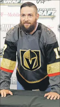  ?? AP PHOTO ?? Vegas Golden Knights’ Deryk Engelland poses for photograph­ers Wednesday, in Las Vegas. Engelland was picked by the Vegas Golden Knights in the NHL expansion draft.