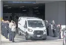  ?? MARIE D. DE JESÚS — HOUSTON CHRONICLE VIA AP ?? A medical examiner’s van exits the Memorial Hermann Hospital, transporti­ng a Harris County Precinct 4 deputy who was shot and killed Saturday in Houston.