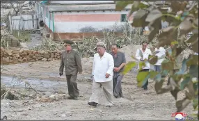  ?? (AP/Korean Central News Agency/Korea News Service) ?? North Korean leader Kim Jong Un on Saturday tours an area of South Hamgyong province damaged by Typhoon Maysak, in this photo provided by the North Korean government.