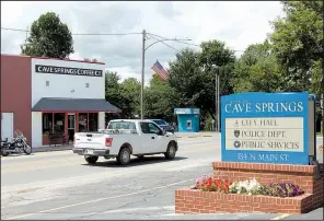  ?? NWA Democrat-Gazette/STACY RYBURN ?? Traffic moves along Main Street in Cave Springs on Friday.