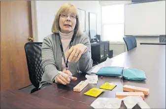  ?? [MARC KOVAC/DISPATCH] ?? Mary Beth Hagstad, nursing manager for the Licking County Health Department, provides training for residents in the use of naloxone.