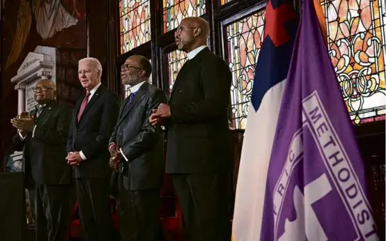  ?? MANDEL NGAN/AFP VIA GETTY IMAGES ?? President Biden was joined by Representa­tive Jim Clyburn (left) at Mother Emanuel church in Charleston, S.C. “What is that poison?” Biden said in his speech. “White supremacy. Throughout our history, it has ripped our nation apart.”