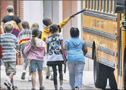  ?? JOHN SPINK / JSPINK@AJC.COM ?? Parents should make sure their kids are getting plenty of rest before sending them off to school. According to the National Sleep Foundation, school-age children need nine to 11 hours of sleep each night, and teenagers need eight to 10 hours.