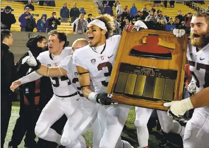  ?? DAN HONDA — STAFF ARCHIVES ?? Stanford’s Michael Rector (3) and Johnny Caspers (57) run with The Axe after beating Cal in The Big Game at Memorial Stadium in 2016.