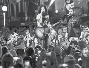  ?? GEORGE WALKER IV/TENNESSEAN.COM ?? Dan + Shay perform on Lower Broadway in Nashville Wednesday during the 2019 CMT Music Awards.