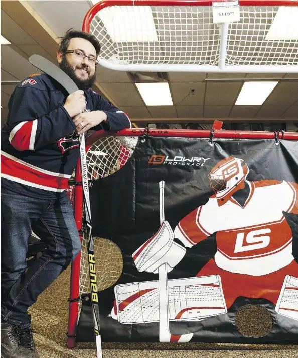  ?? IAN KUCERAK ?? Journal reporter and hockey newbie Juris Graney gets ready to learn to play the game he’s grown to love watching.