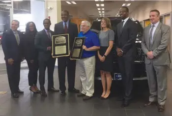  ??  ?? Sutton Ford and Lincoln management pose with the two President’s Awards. Pictured ( l to r) are Dave Mason, Simone Toney, Ivan Boykin, Nate Sutton, Randy Mohrbach, Dawn Valeski, John Allen and Randall Rightmyer.