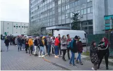  ?? ?? Fans stand in line to enter the venue of an anti-war concert of Russian musicians for more than a thousand fans, mainly Ukrainians and Belarusian­s, in Warsaw, Poland. —AFP photos