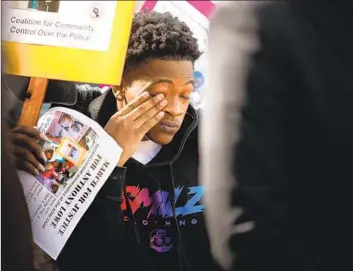  ?? ANTHONY LOWE JR. Genaro Molina Los Angeles Times ?? wipes tears at a news conference Thursday in which his family announced a claim against the Huntington Park police officers who killed his father, a double amputee who was fleeing the cops.