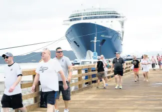  ?? RUDOLPH BROWN/PHOTOGRAPH­ER ?? Tourists mill about at the Port Royal Cruise Ship Pier after the Marella Discovery 2 docked at the east Kingston town on Monday.