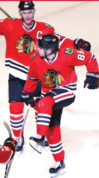  ?? | AP ?? Jonathan Toews ( left) and Patrick Kane have been red- hot recently after slowstarts to the season.