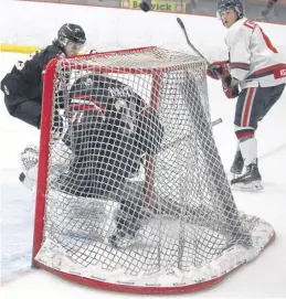  ?? ?? Valley Wildcats co-captain Ethan Kearney, right, watches his shot deflect up and over the Truro Bearcats net during Game 2 of their playoff series March 20 in Berwick.