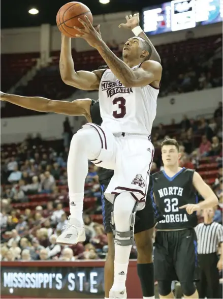  ?? Kelly Price, MSU athletic media relations, for Starkville Daily News) (Photo by ?? Mississipp­i State's Xavian Stapleton (3) takes the basketball to the goal during Saturday's game against North Georgia.