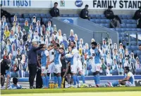  ??  ?? Blackburn Rovers players take a drinks break in front of the ‘home supporters’