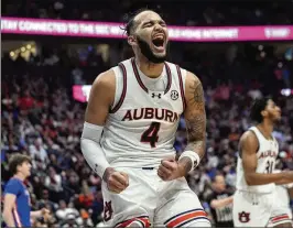  ?? JOHN BAZEMORE/AP ?? Auburn forward Johni Broome leads the Tigers to their first SEC Tournament title since 2019 and an automatic berth in the NCAA Tournament with his 19 points and 11 rebounds against the Florida Gators on Sunday in Nashville.