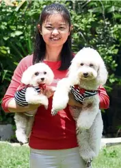  ??  ?? Chan with her bundles of joy, Olly (left) and Miki. — Photos: S.S. KANESAN/The Star