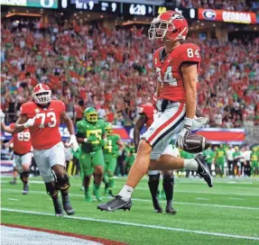  ?? TODD KIRKLAND/GETTY IMAGES ?? Wide receiver Ladd McConkey averaged 14.2 yards per catch in three seasons at Georgia.