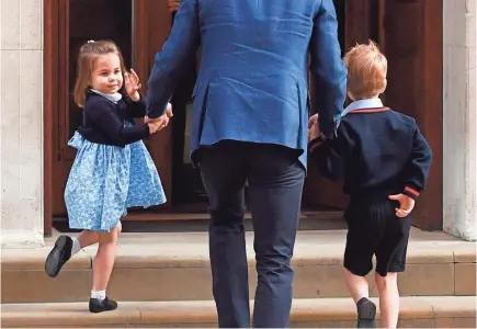  ?? BEN STANSALL, AFP/GETTY IMAGES ?? Charlotte and George are led by their father, Prince William, to visit their newborn brother.